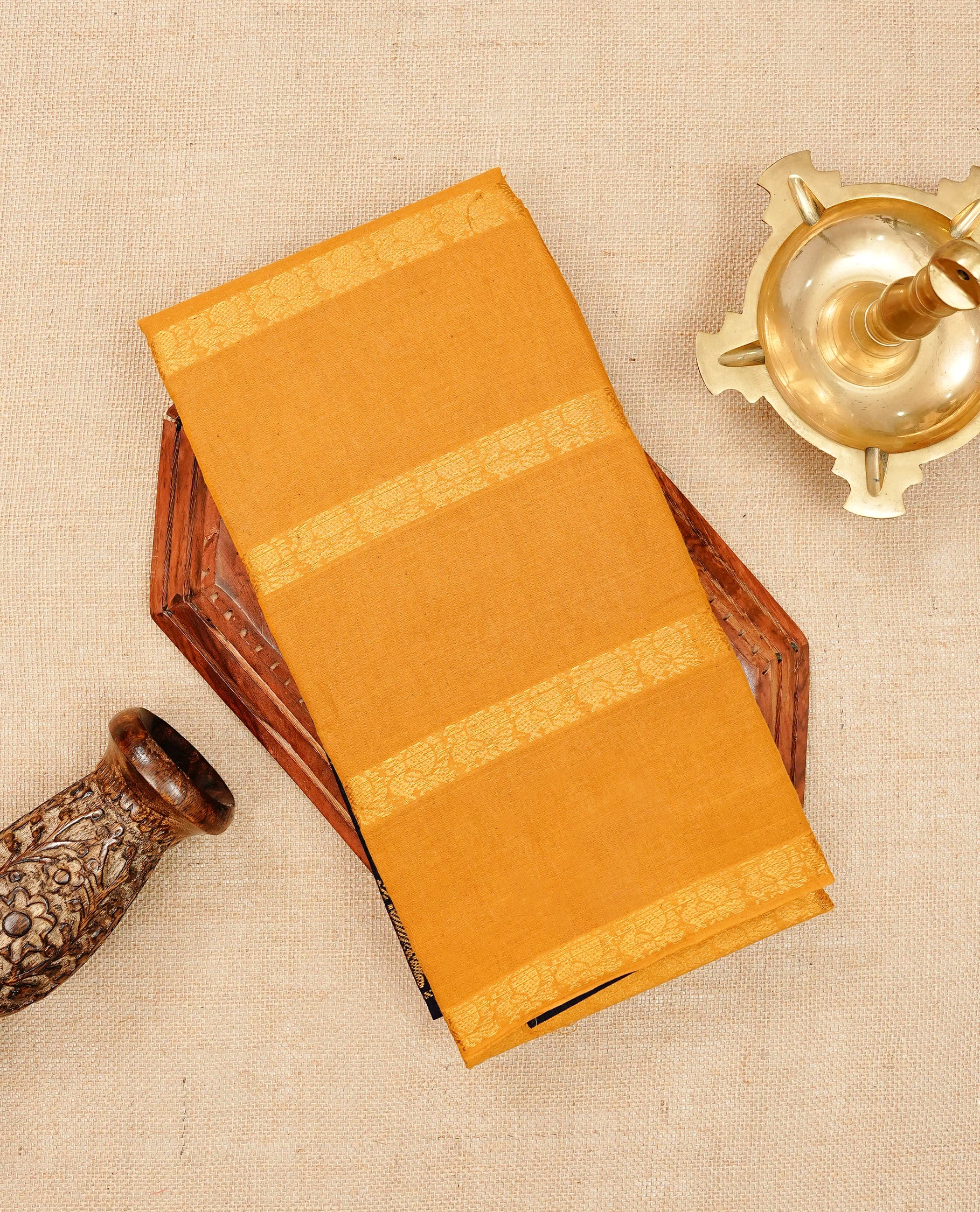 Mustard yellow Sungudi cotton saree featuring elegant gold zari striped Peacock pattern across the body, complemented by a contrast border. Paired with a matching blouse piece