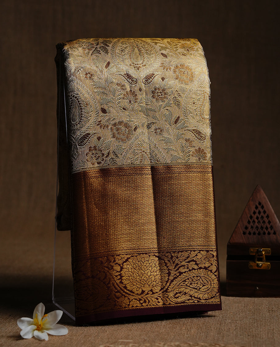 Gold & Maroon double shade colour kancheepuram tissue silk saree featuring gold zari floral kodi pattern on body, complemented by contrast Maroon colour with traditional border, paired with matching blouse piece.