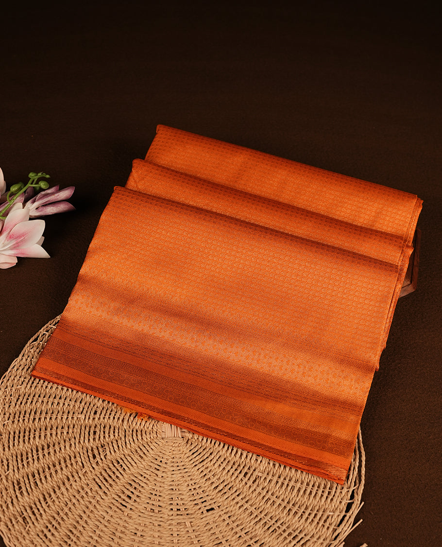 Orange colour softie silk saree featuring square dotted stripes across body, complemented by self colour with traditional border, paired with matching blouse piece.