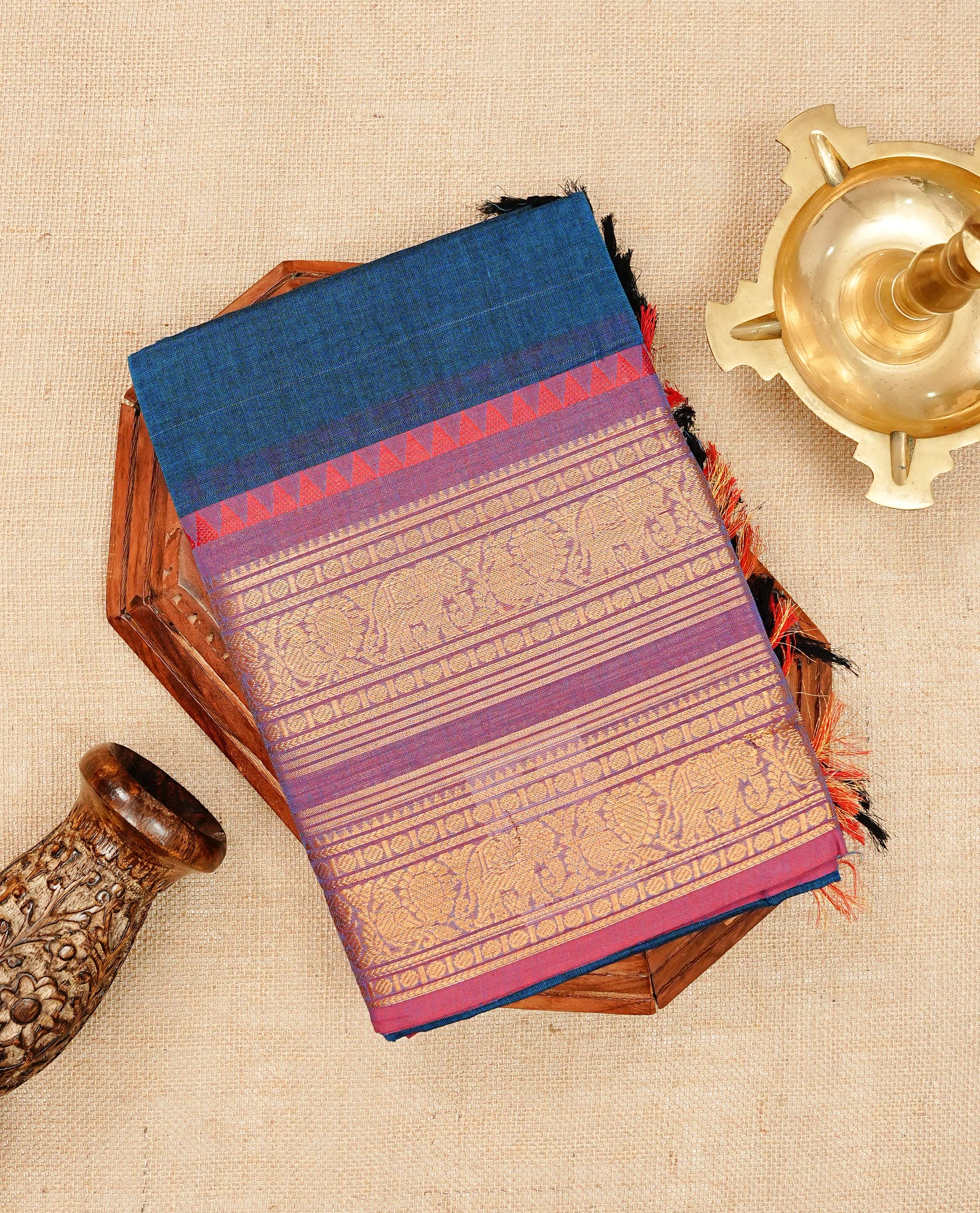 Peacock blue colour chettinad cotton saree featuring elegant plain body, Contrast magenta & purple dual shade colour with Gold zari border, comes with matching blouse piece.