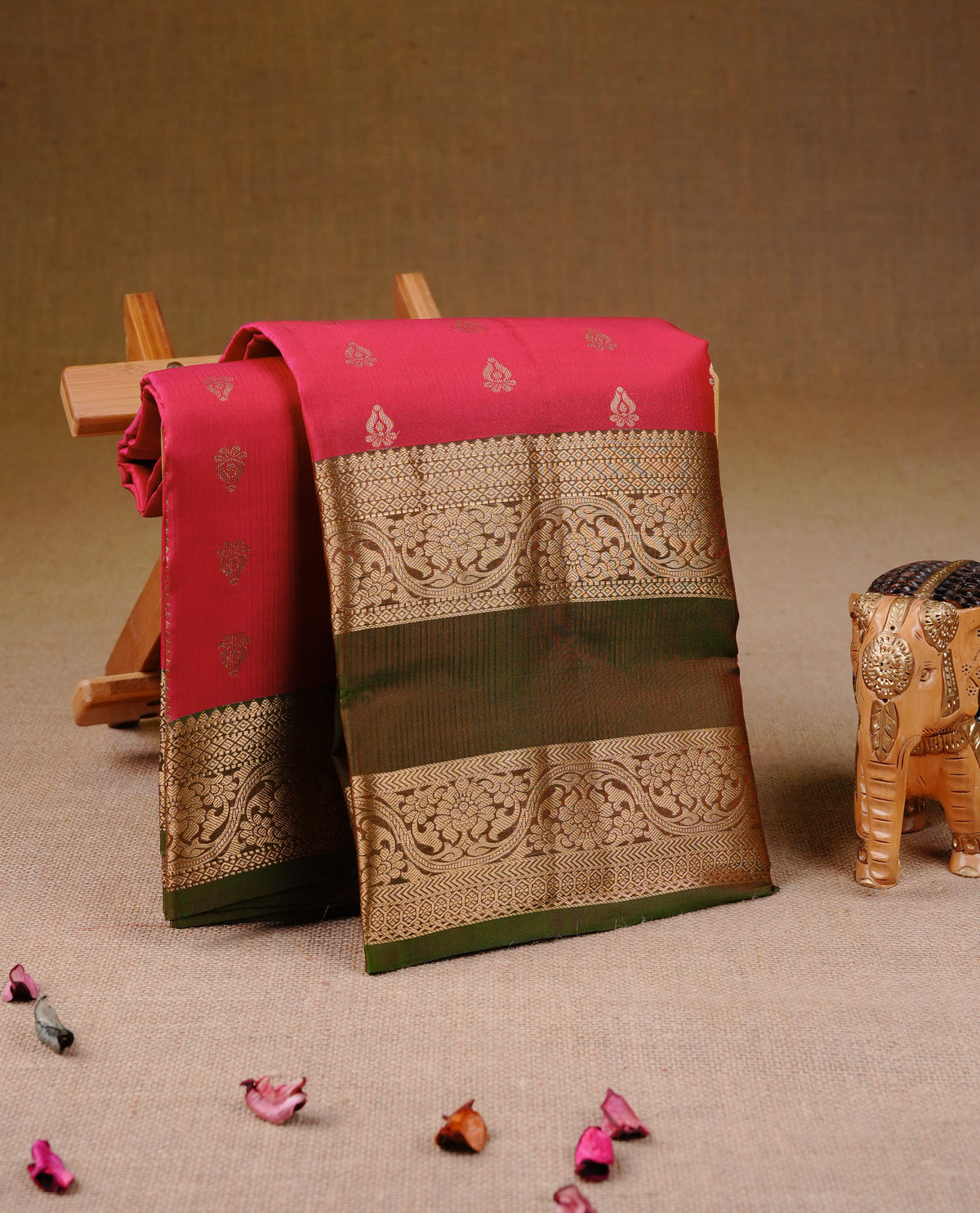 Rani Pink Colour Traditional Kancheepuram Silk Saree with Elegant Gold Zari Buttas on the Body, Enhanced with a Contrast Olive Colour Grand Gold Zari Border and Rich Pallu, Paired with a Matching Blouse Piece