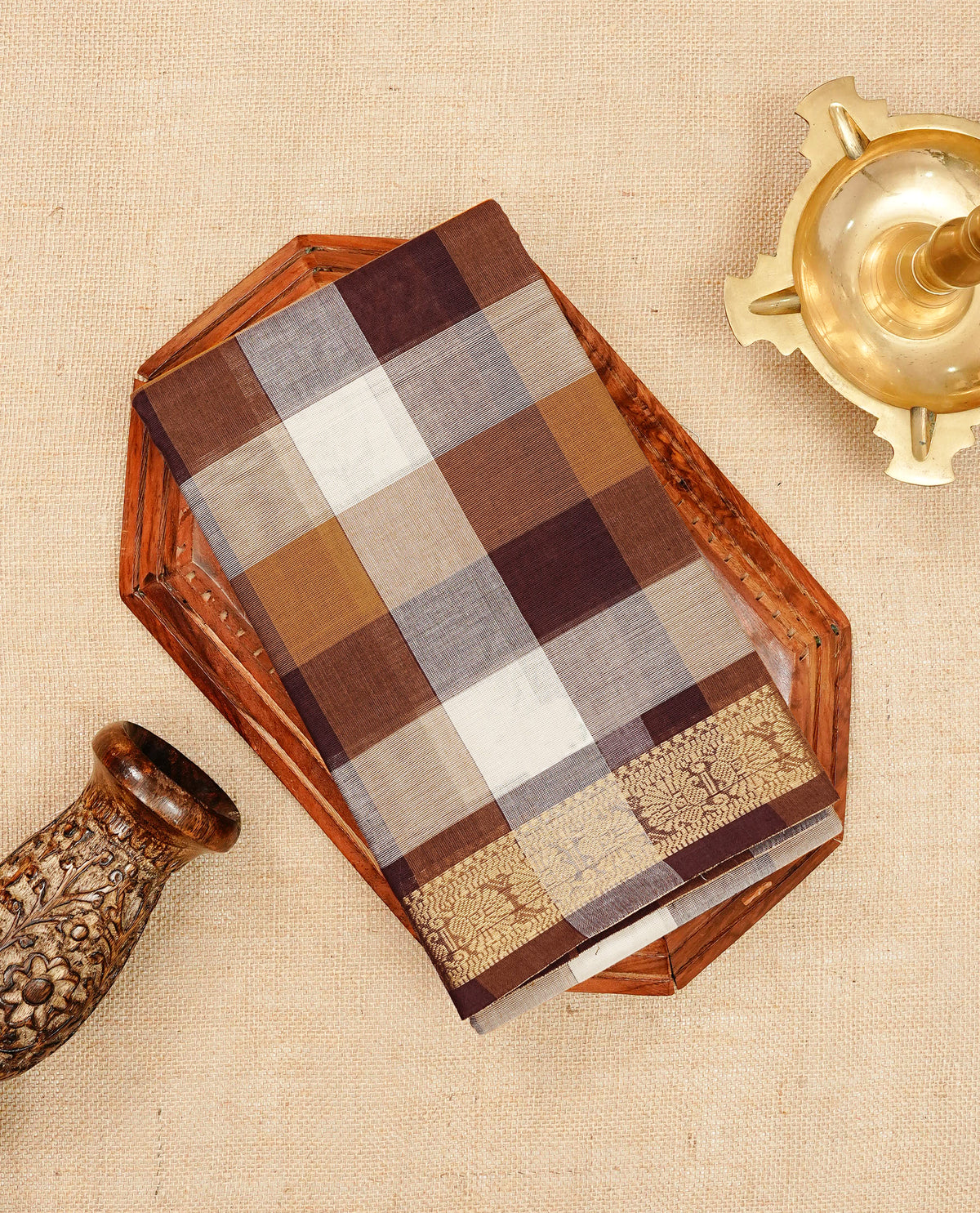 Multi colour Chettinad cotton saree featuring a check pattern on the body, complemented by a self colour with gold zari border, comes with a matching blouse piece