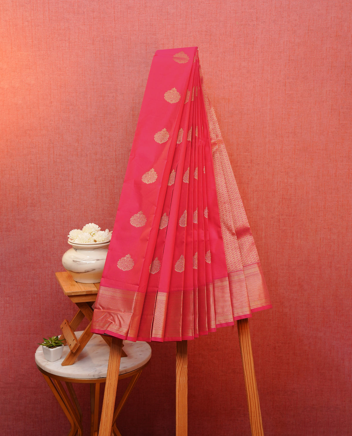 Pink colour soft silk saree featuring gold zari motifs on body, contrast self colour gold zari checkerd border, grand pallu comes with matching blouse piece.