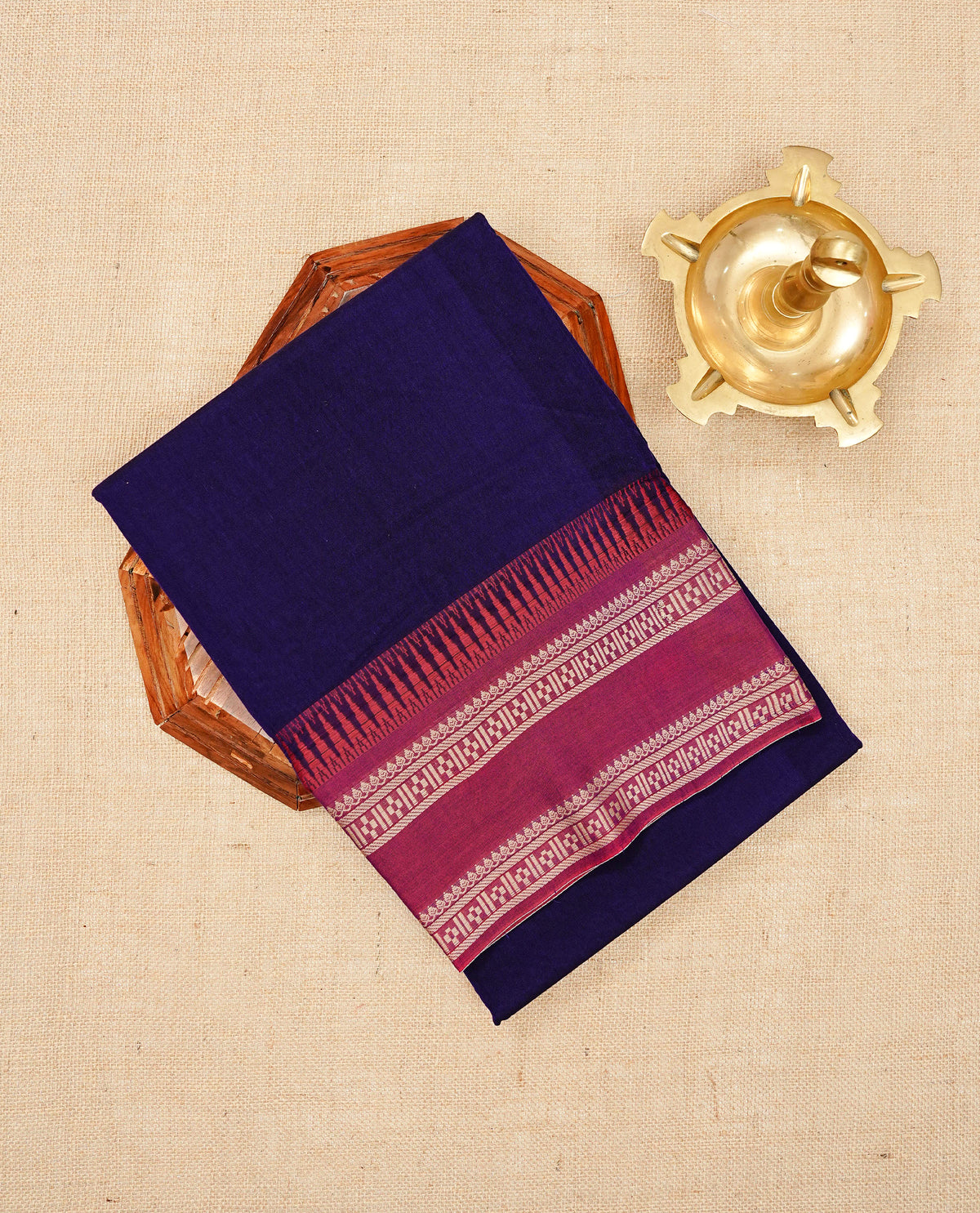 Purple colour Narayanapattu cotton saree with a plain body, complemented by a magenta Colour with Beige colour border & contrast pallu, paired with a matching blouse piece.