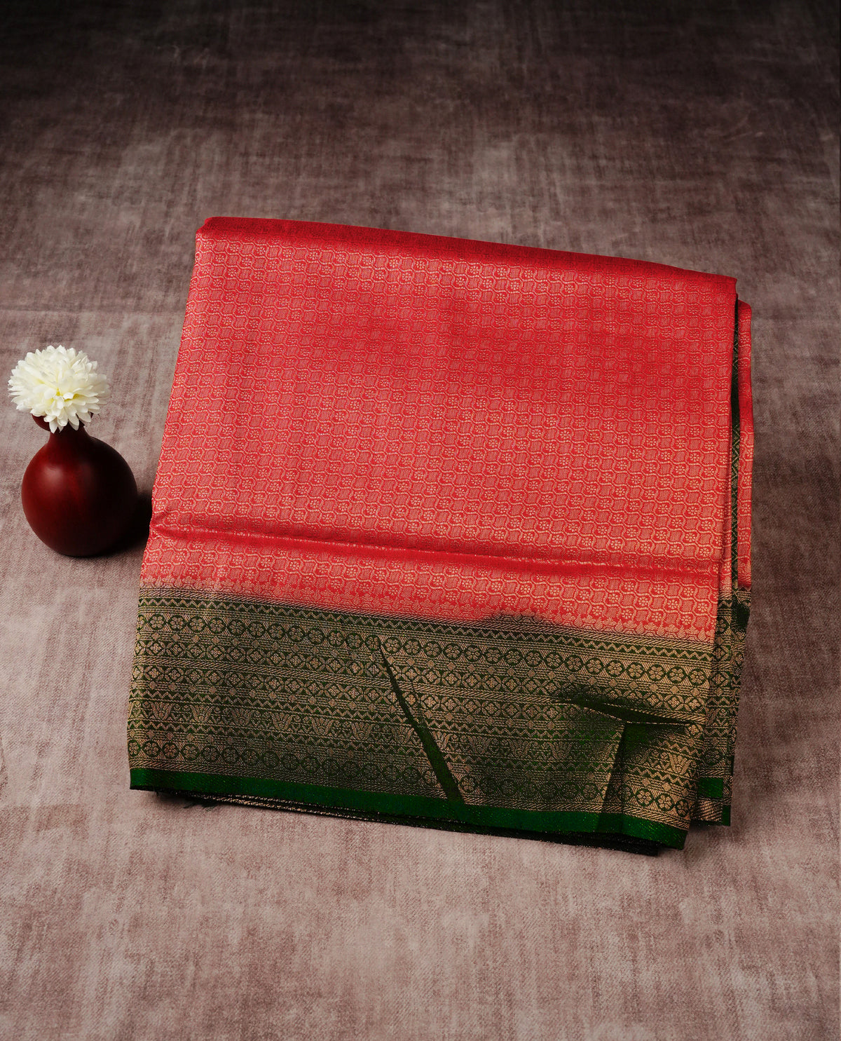 Crimson red colour softie silk saree featuring gold zari, rich pallu brocade body, with contrasting forest green colour border.paired with matching blouse piece.