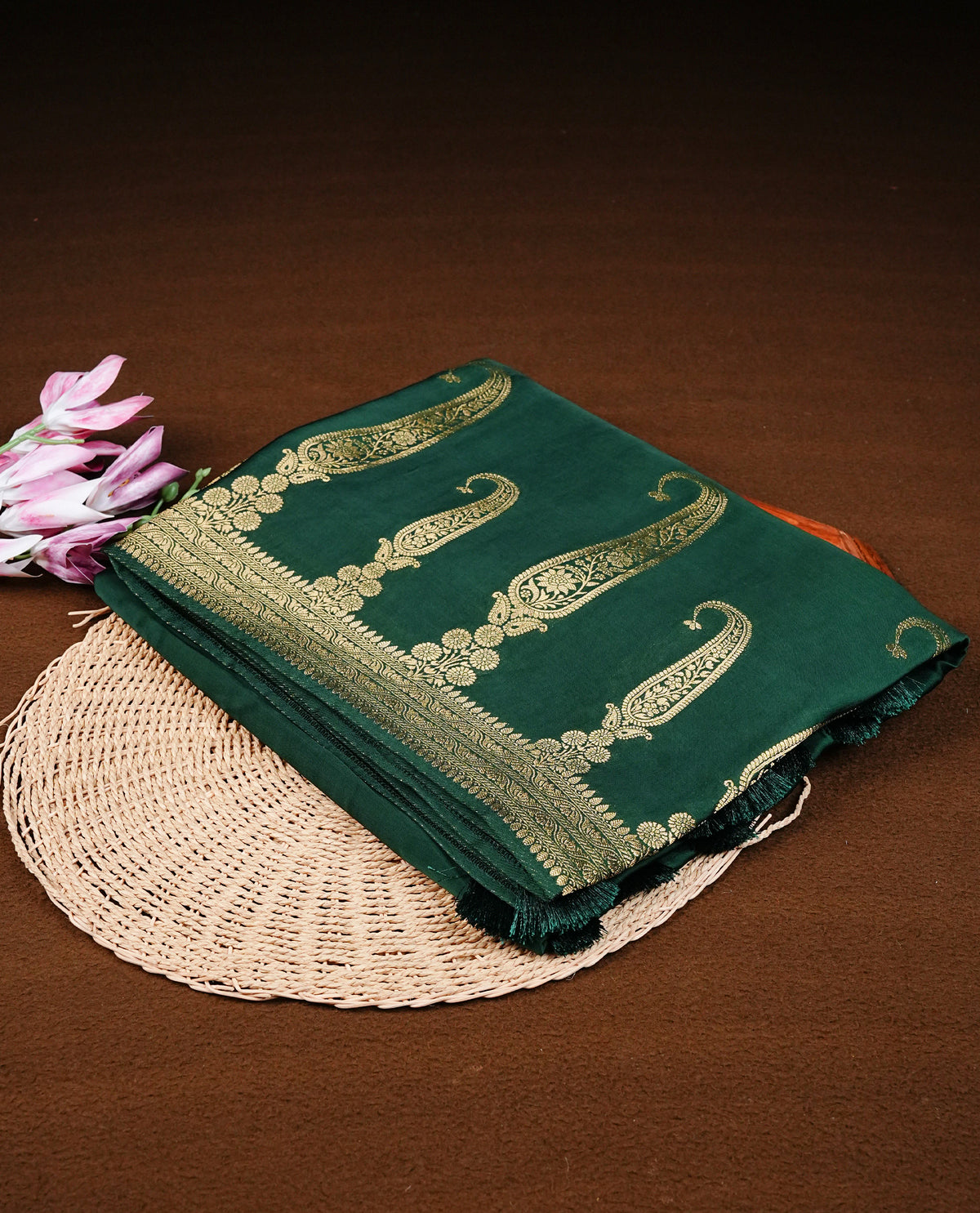 Green colour Banaras satin crepe silk saree featuring Plain body, associate with Gold zari traditional border, comes with matching blouse piece.