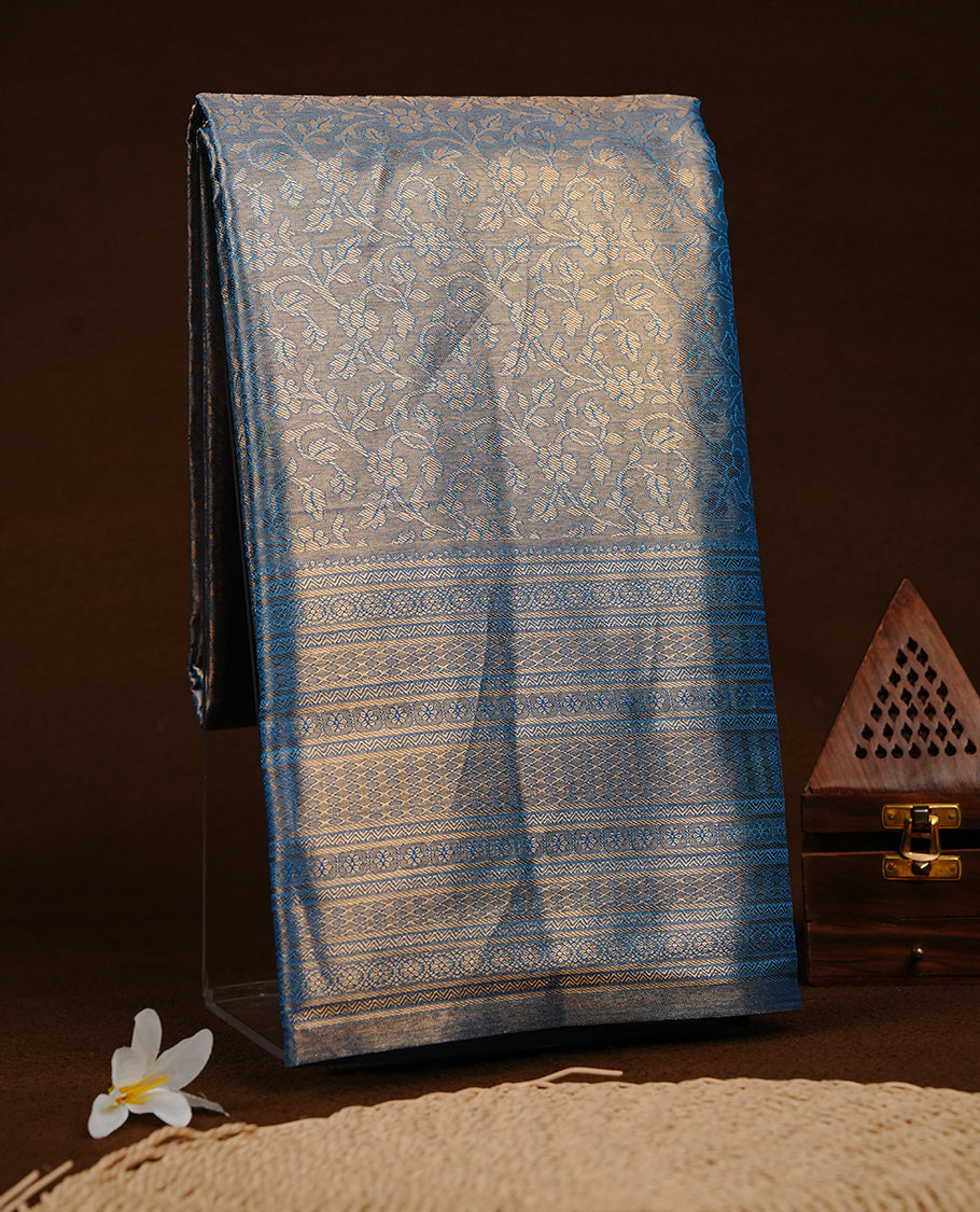 Blue & Gold colour semi tissue silk saree featuring gold zari pattern on body, self colour with gold zari traditional border, paired with matching blouse piece.
