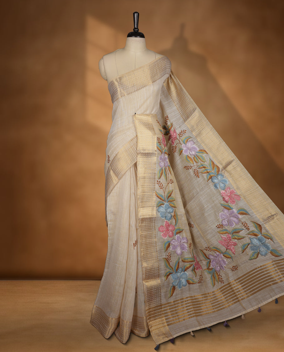 Beige colour Banarasi linen silk saree featuring hand brushed colour with Floral & birds printed pattern on body, gold zari woven geometric design border with self colour pallu and comes with a matching blouse