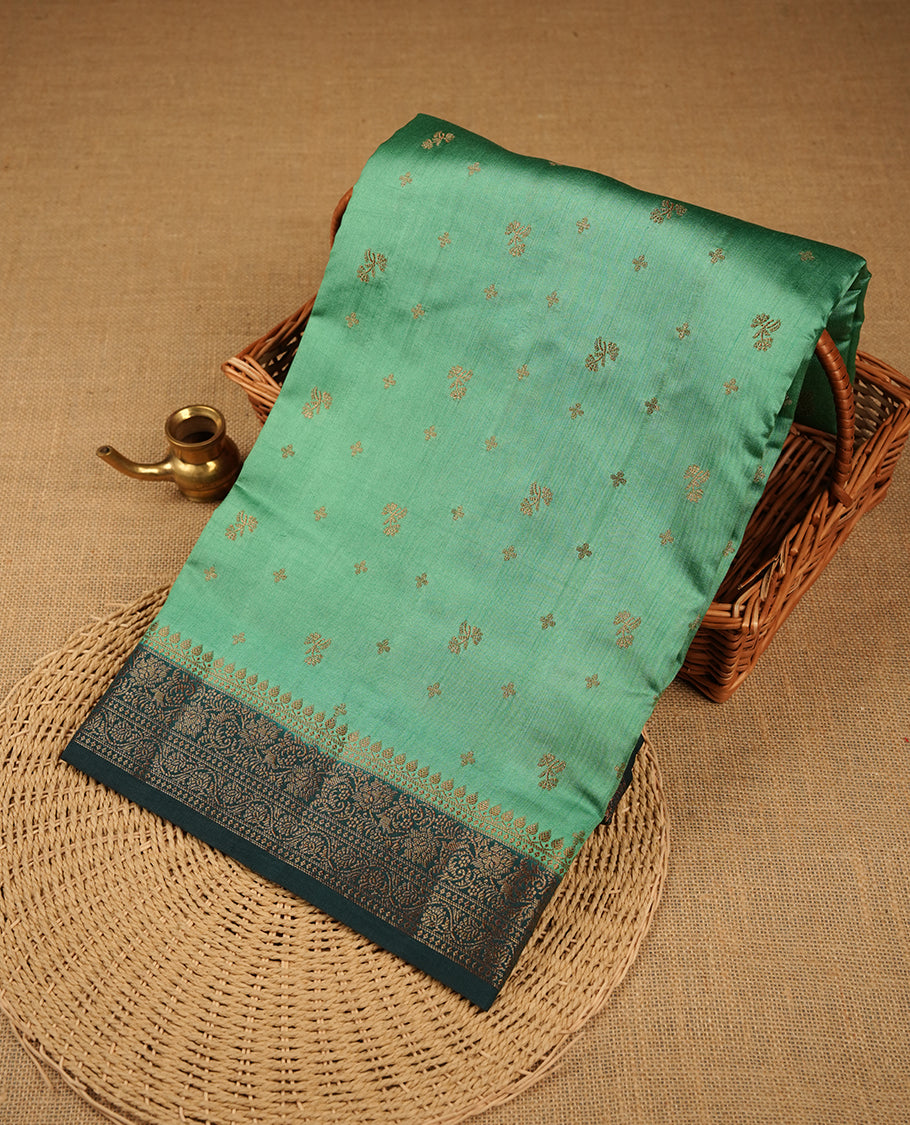 Teal colour Pure banaras soft silk saree featuring Antique zari motifs on body, contrast dark teal colour border , traditional pallu and paired with matching blouse