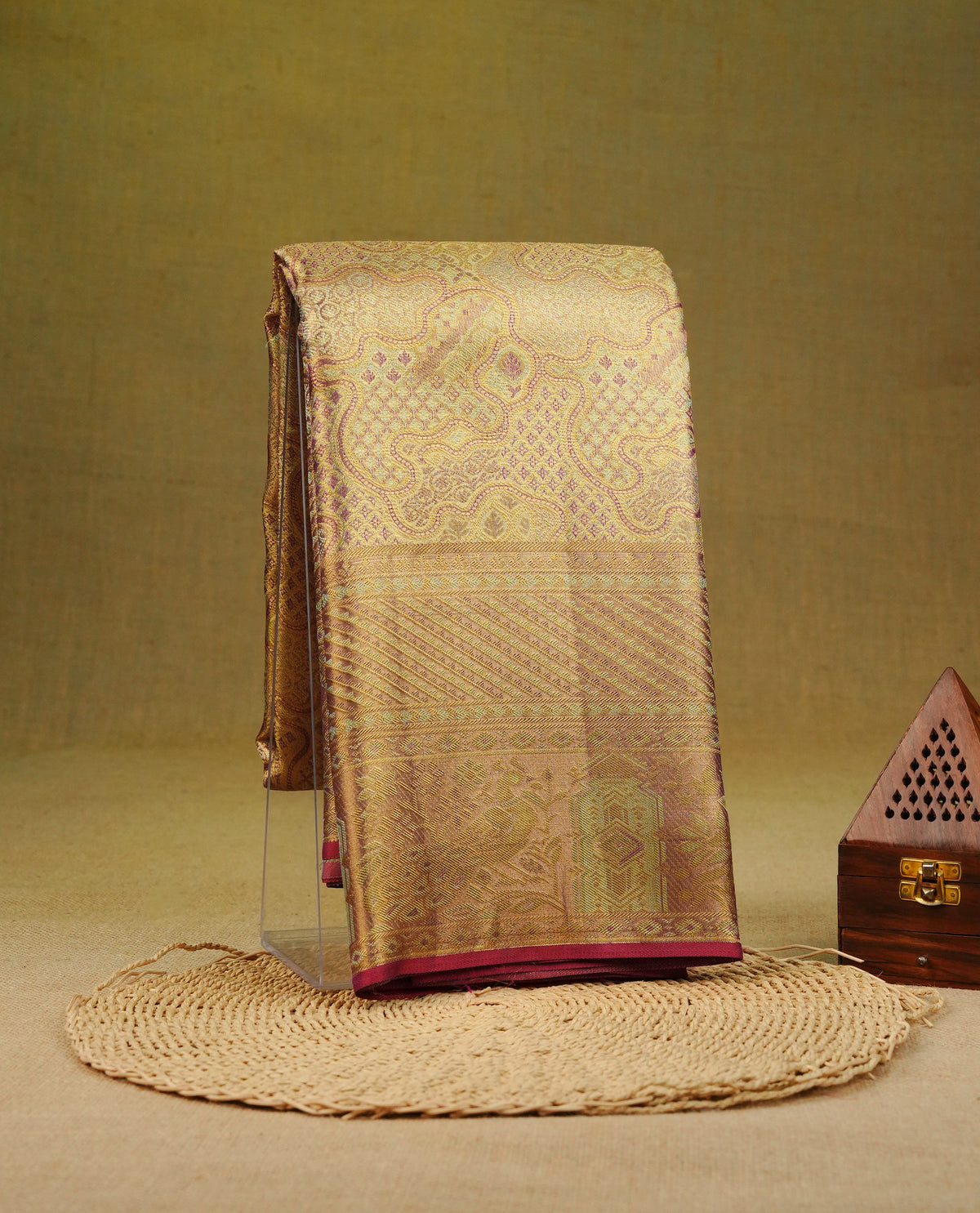 Gold & Red double shade colour pure tissue silk saree featuring Gold zari pattern on body, complemeneted by Self Colour Fancy border with peacock and floral motifs, comes with matching blouse piece.