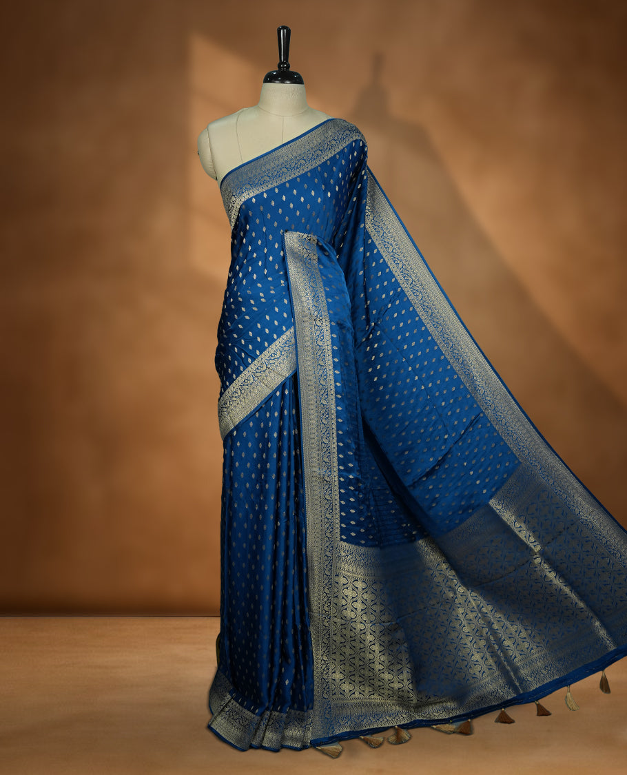Royal Blue Colour Semi Banarasi Satin Crepe Saree with Silver Zari Buti Motifs, Traditional Gold Floral Pallu, Elaborate Woven Border, Decorative Tassels with Matching Blouse