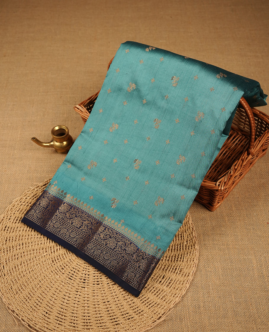 Steel blue colour Pure banaras soft silk saree featuring Antique zari motifs on body, contrast navy blue colour border , traditional pallu and paired with matching blouse
