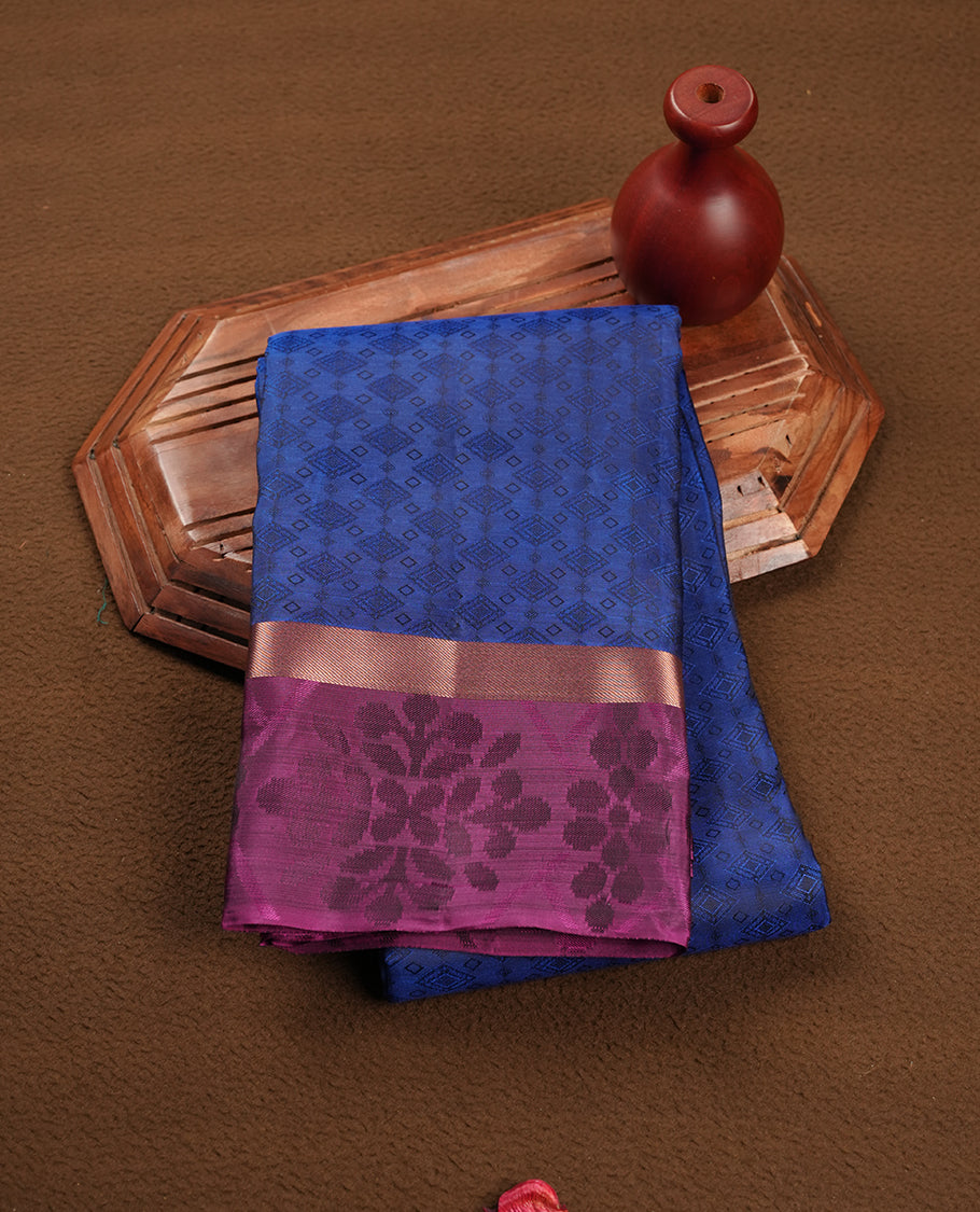 Blue colour soft silk saree featuring gold zari motifs on the body, complemented by a contrast Magenta zari floral kodi border and pallu, paired with a matching blouse piece.