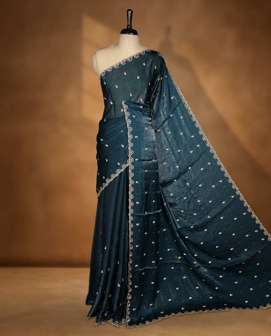 Peacock blue Colour velvet Chiffon Designer Saree featuring Delicate White Stone motifs on Body, with Stone Detailing on the Border and Pallu, paired with a Matching Blouse.