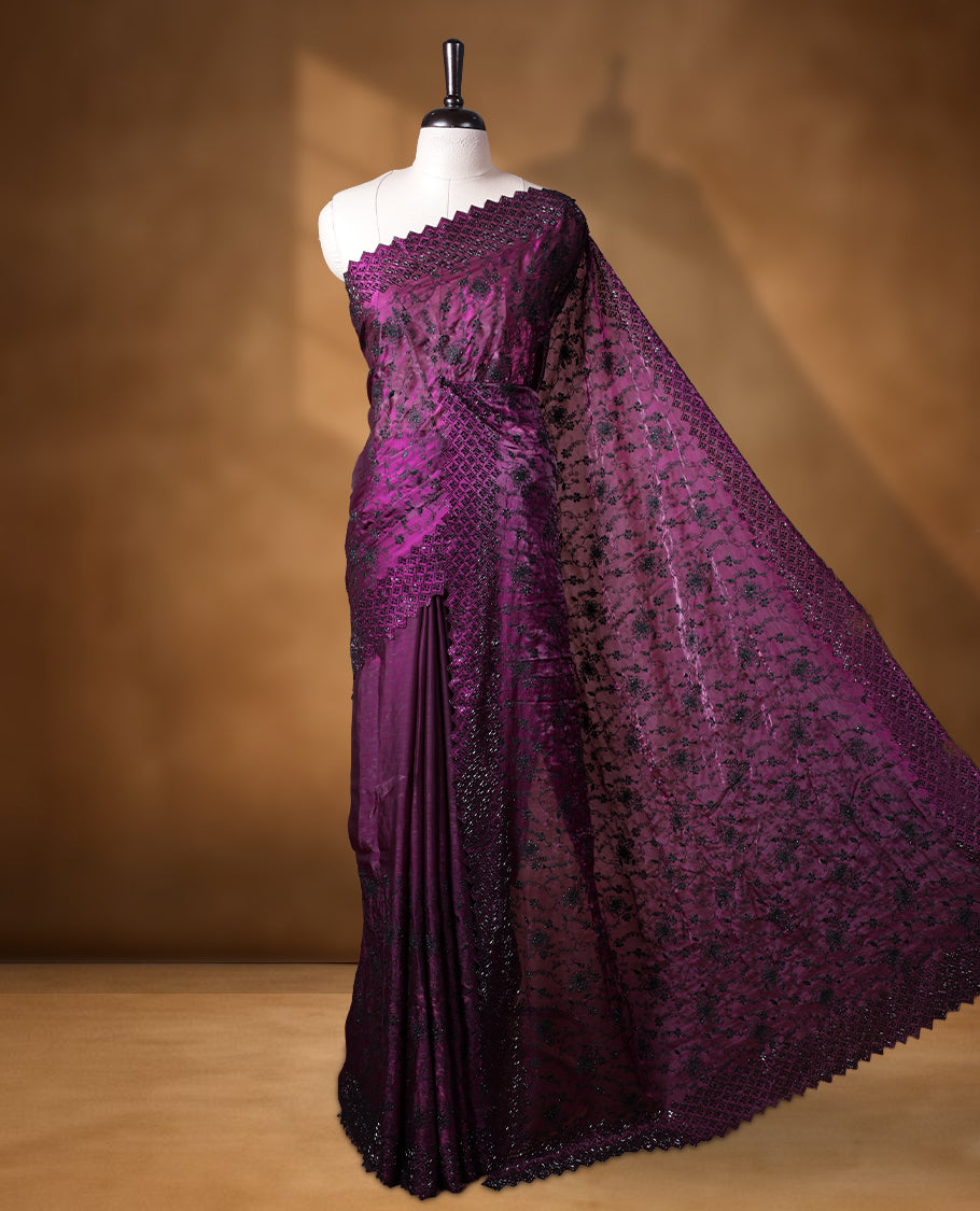 Dark Purple colour velvet chiffon designer saree, featuring black thread embroidery kodi pattern on body, black cut stone work and heavy stone border, pallu and Paired with matching blouse.