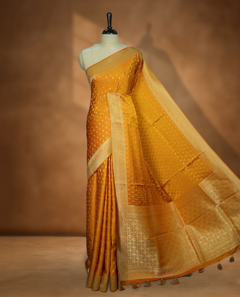 Golden Colour Semi Banarasi Satin Crepe Saree with Silver Zari Leaf Motifs, Traditional Gold Interwoven Pallu, Elaborate Woven Border, Decorative Tassels with Matching Blouse