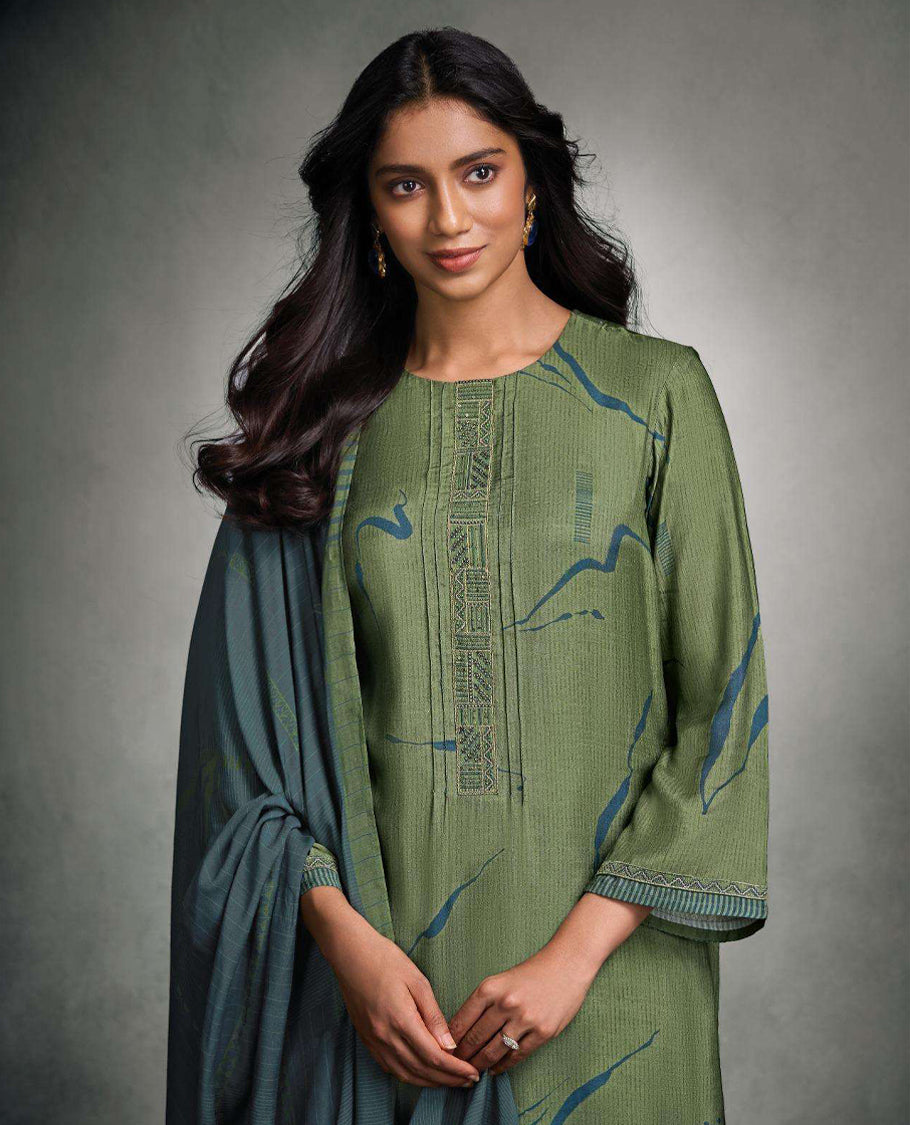 Muted Sage green colour suit material with pakiza silk digital print top with embroidery worked sleeve, paired with matching satin bottom and contrast colour pakiza light weight print with embroidery lace dupatta.