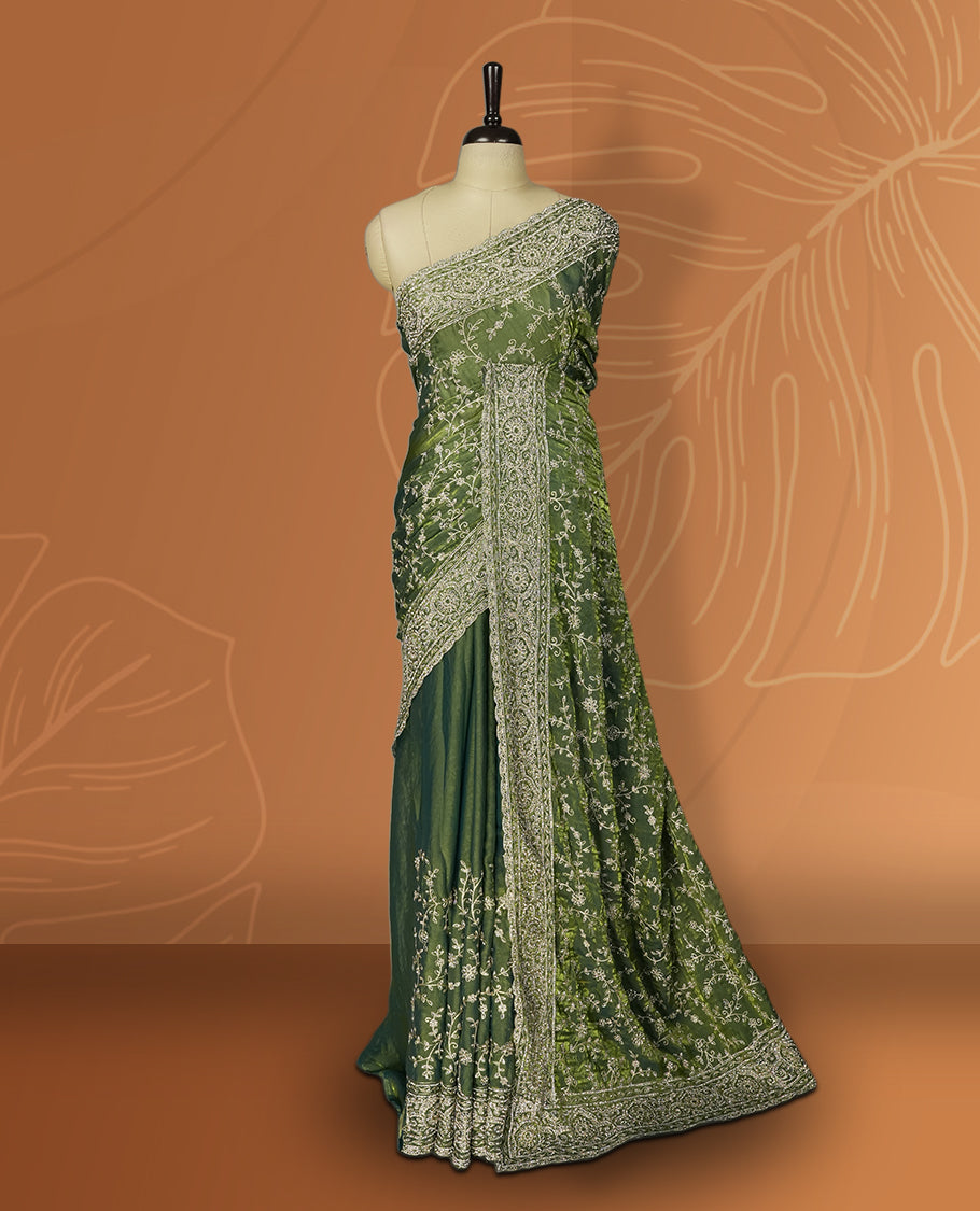 Pista green colour velvet chiffon designer saree in elegant two tone shades, featuring light gold zari, kodi work with handwoven style thread aari & dori embroidery work, Swarovski stone work and all over motifs, comes with matching blouse.