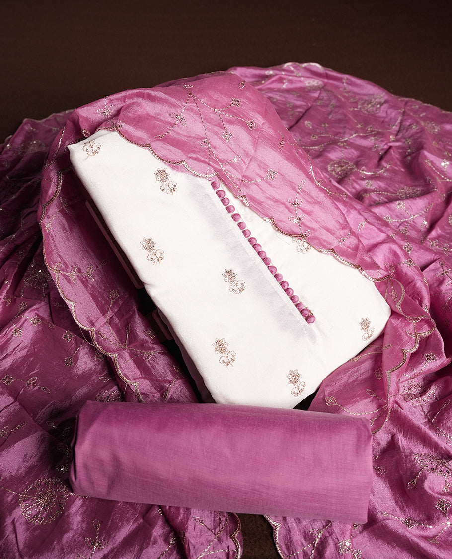 White colour churidhar material featuring thread embroidery on the front panel, contrast Pink colour dupatta with elegant border, and matching plain bottom