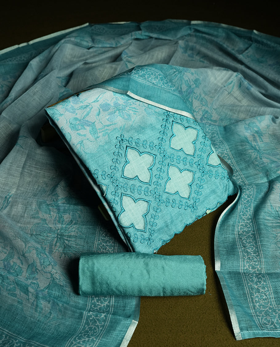 Pastel Aqua blue colour churidhar material featuring cutwork and thread embroidery on the front panel, floral digital printed dupatta with elegant border, and matching plain bottom.
