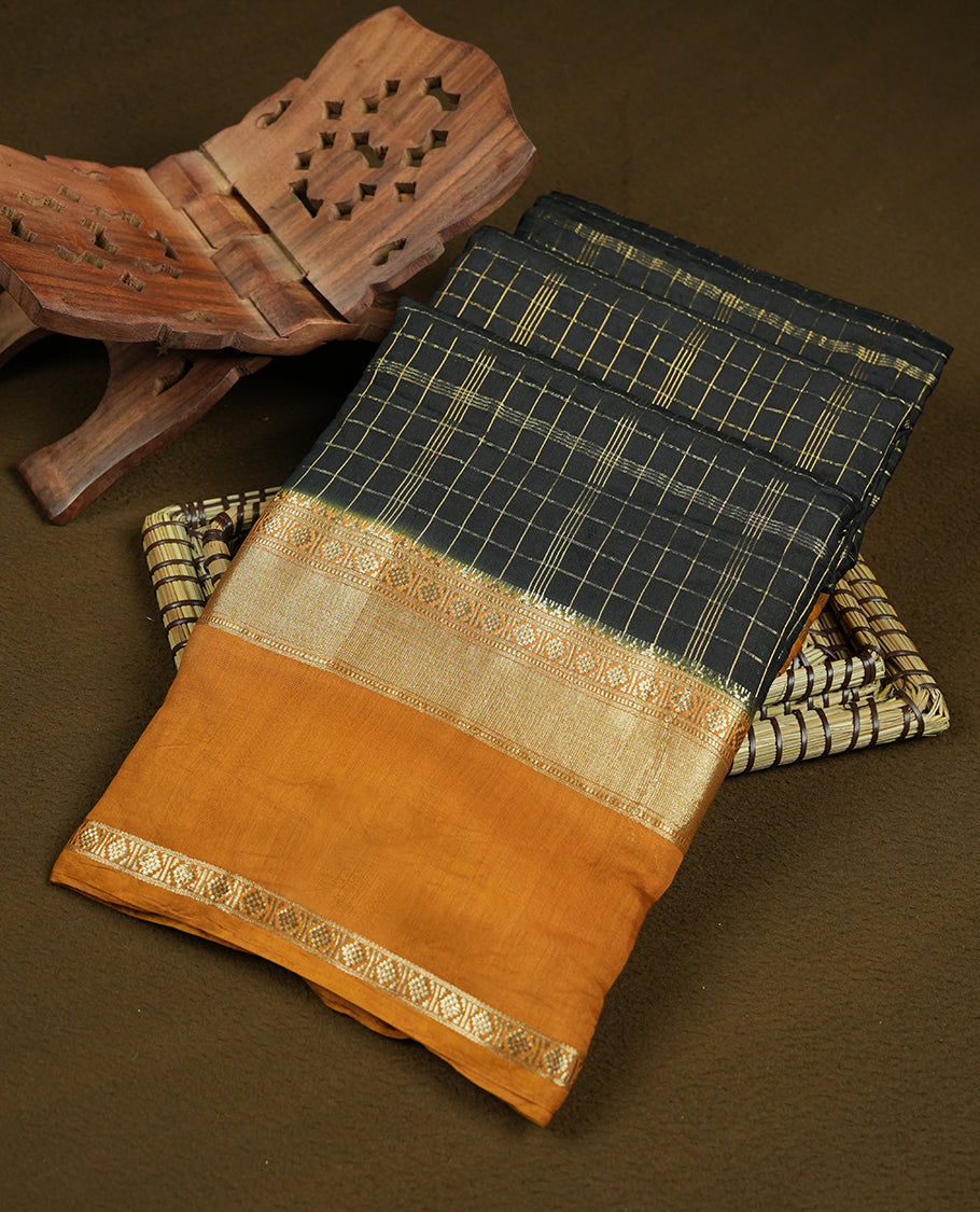 black colour mixed chanderi cotton saree with golden checkered body, mustard orange pallu with golden zari border, matching blouse.