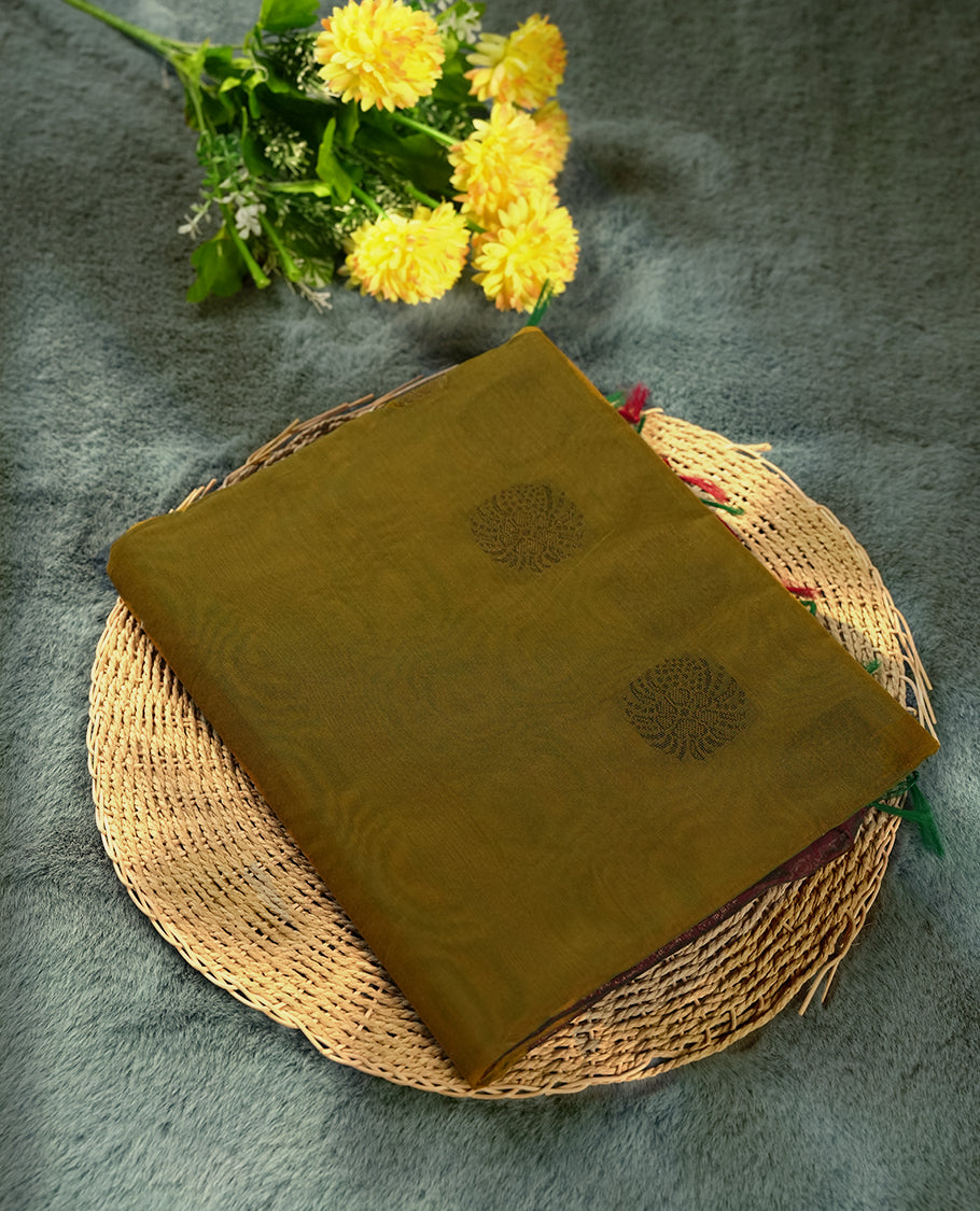 Golden brown colour soft silk cotton saree adorned with floral motifs and Enhanced by a beautifully rich maroon floral woven contrasted pallu & Comes with a matching blouse piece for a complete look.