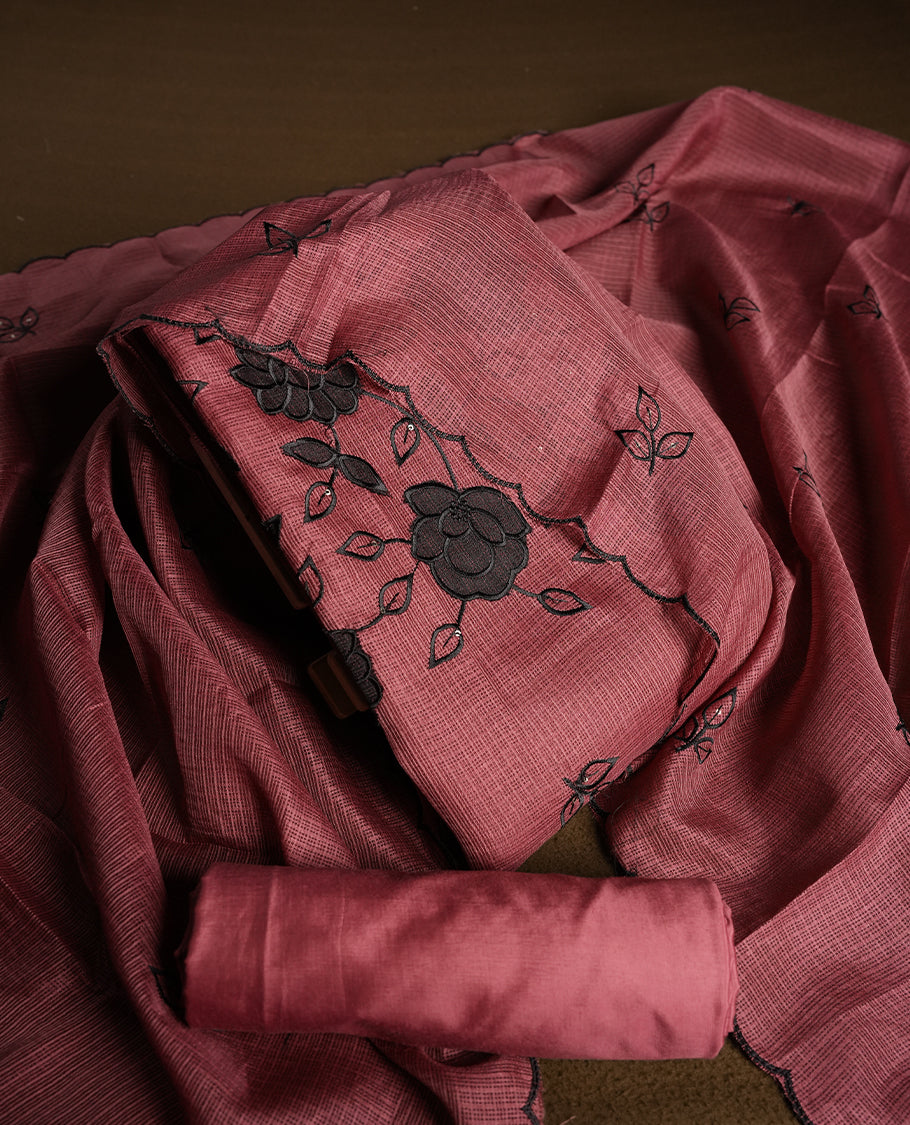 Pink colour churidhar material featuring Black colour thread embroidery on the front panel, self colour dupatta with elegant border, and matching plain bottom