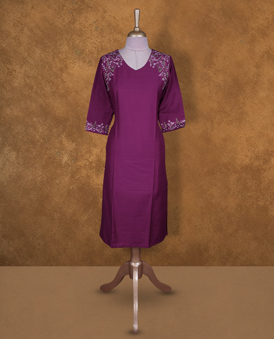 Magenta colour kurti by Talisha with V neckline, delicate floral embroidery on the shoulders and sleeve cuffs, straight calf‑length silhouette, and elbow‑length sleeves.