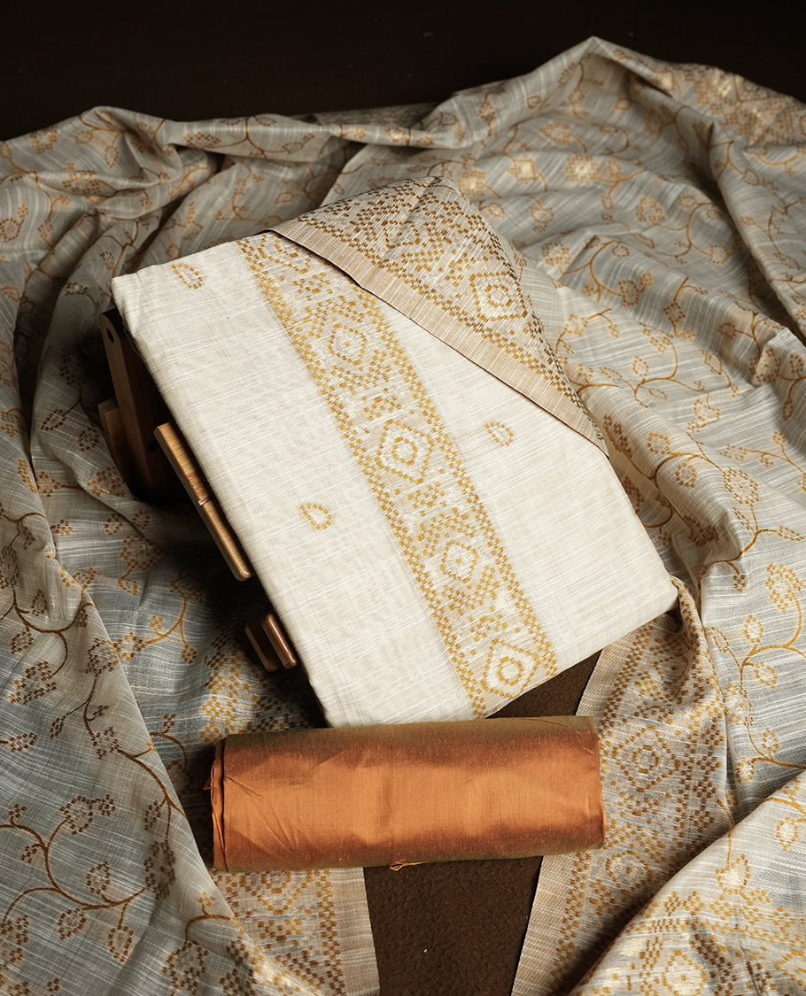 Cream colour churidhar material featuring Gold colour thread embroidery on the front panel, floral thread pattern dupatta with elegant border, and matching plain bottom.