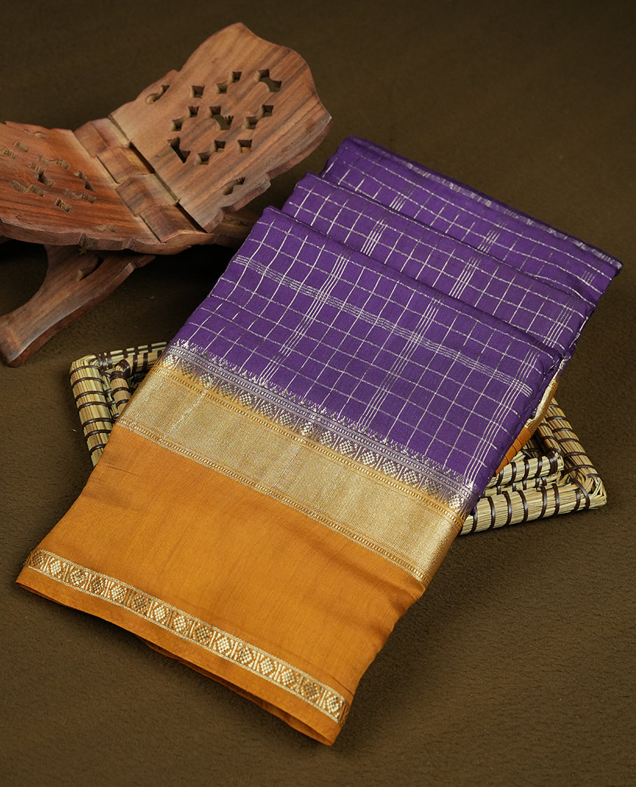 Purple colour mixed chanderi cotton saree with silver zari checkered body, mustard-golden pallu with grid pattern, golden zari border, and matching blouse