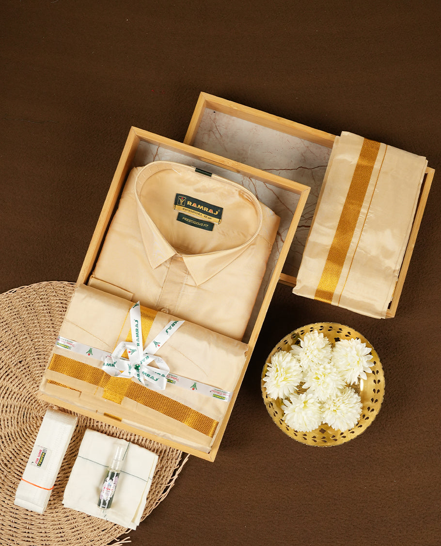 RAMRAJ Fresh Peach Colour shirt paired with a matching dhoti and towel, all elegantly finished with a gold border.