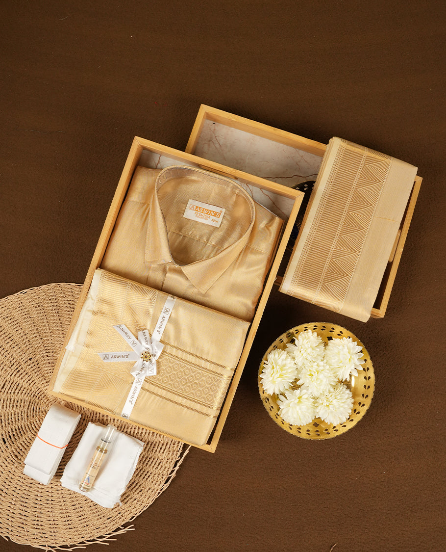 Biscuit colour Aswin’s wedding set featuring a refined silk shirt and matching dhoti with gold zari detailing, crafted for timeless elegance and perfect for traditional weddings and festive occasions.