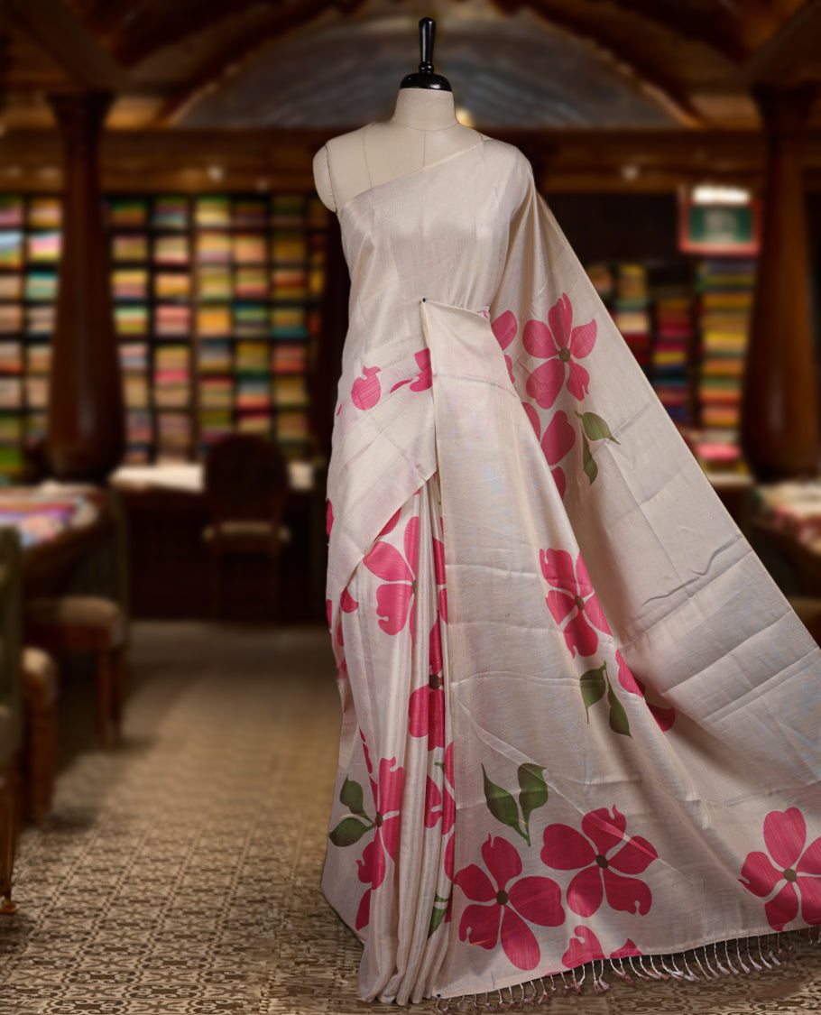 Beige colour Semi tissue saree adorned with pink colour digital Bold Floral Design on the body and an elegant pallu & comes with a matching blouse piece