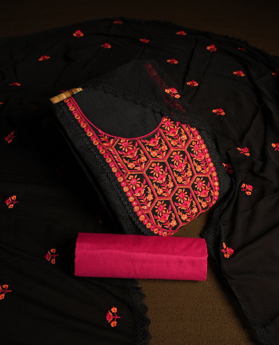 Black colour hakoba churidhar material featuring beautiful magenta and orange floral embroidery on the neckline and front panel, highlighted with lace detailing & Comes with an embroidered dupatta and contrast magenta colour bottom.