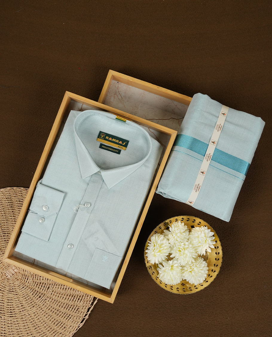 RAMRAJ Cyan Colour shirt paired with a matching dhoti, elegantly finished with a gold border.
