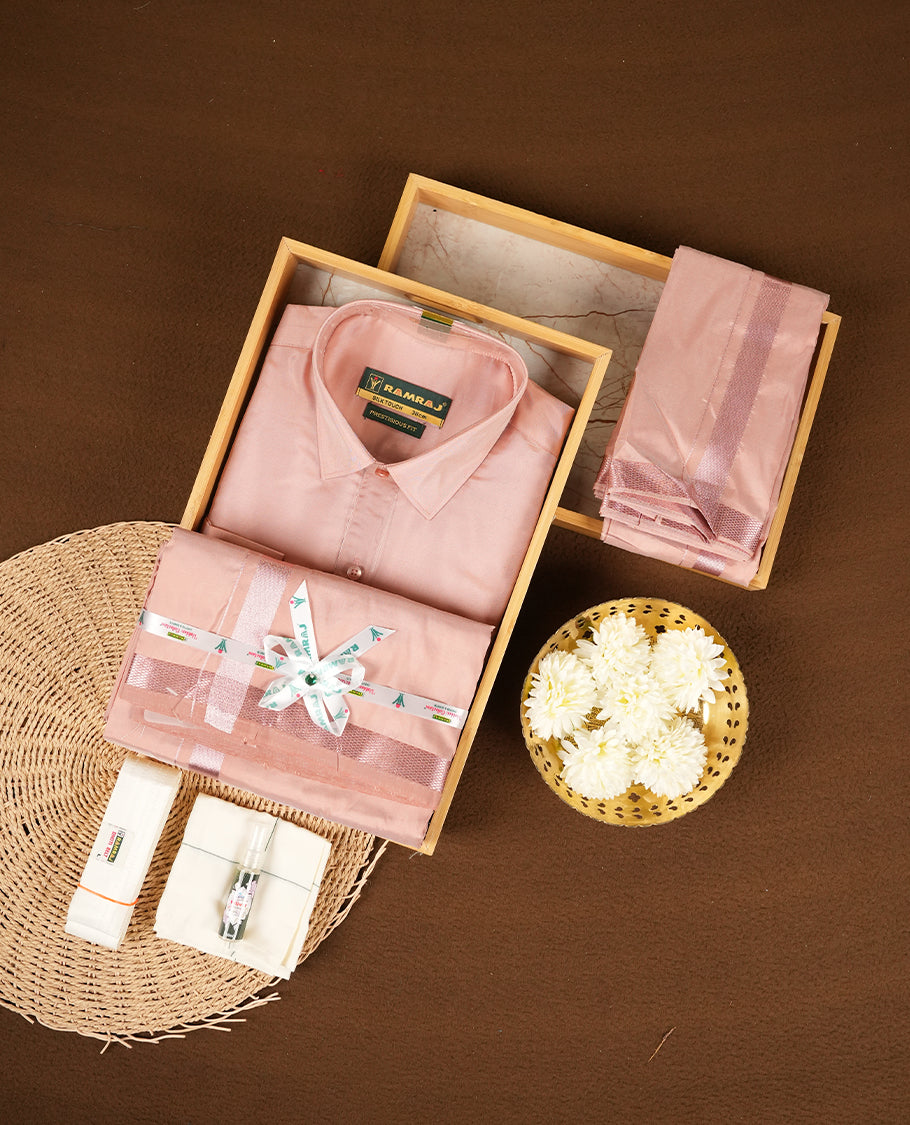 RAMRAJ Pink Colour kurtha paired with a pink dhoti and a pink towel, elegantly finished with a matching Rose Gold border.