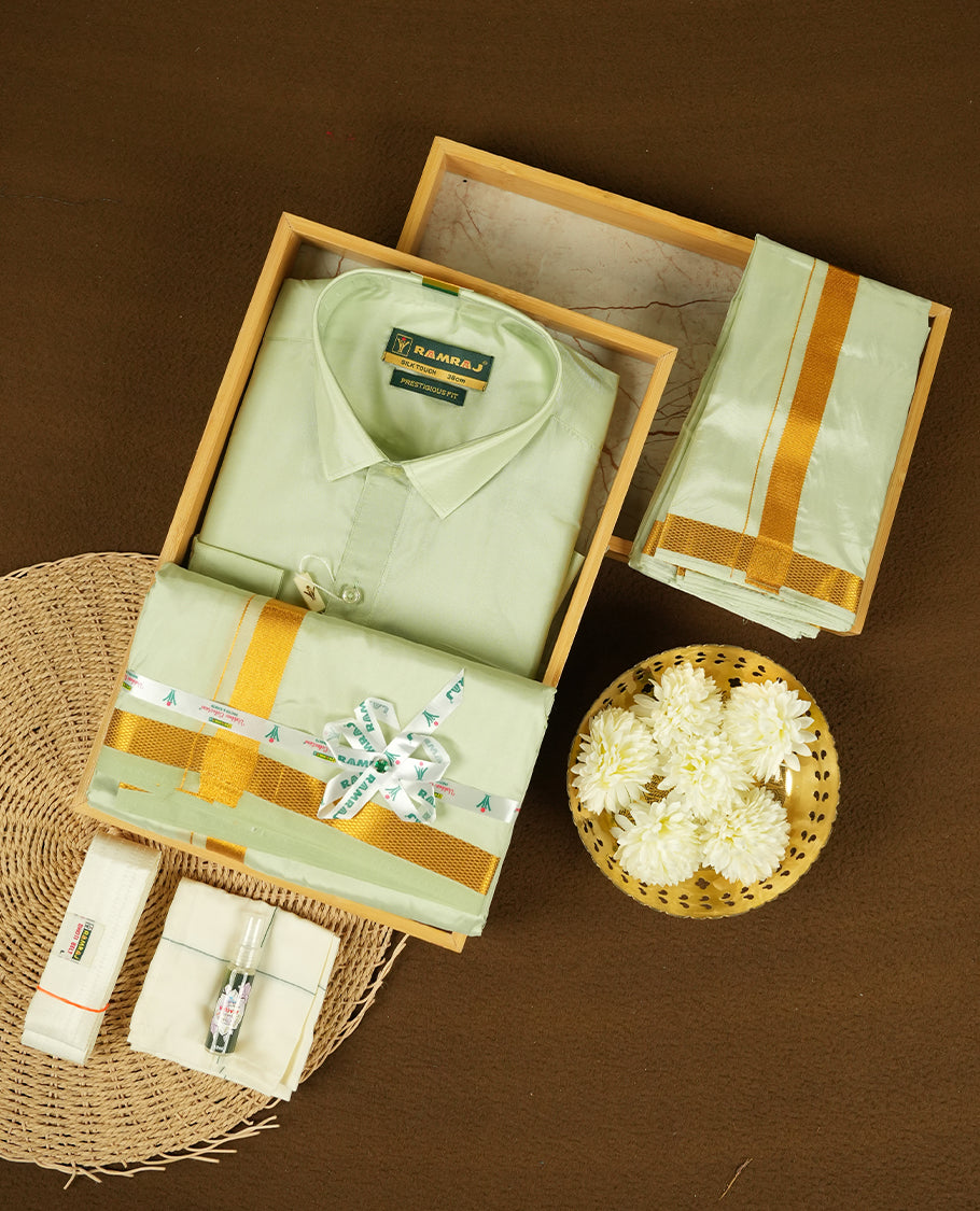 RAMRAJ Light Green Colour kurtha paired with a Light Green dhoti and a Light Green towel, elegantly finished with a matching Gold border.