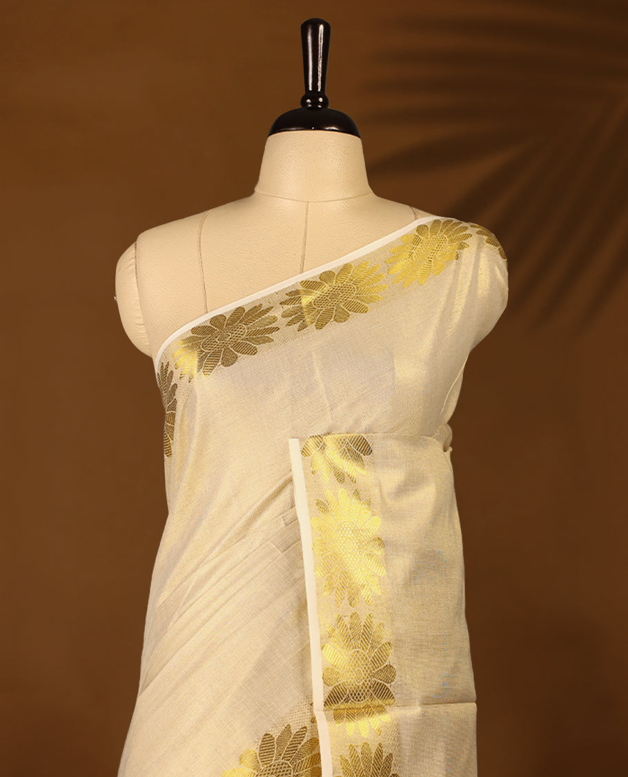 Light Gold colour Tissue Kerala saree featuring Plain body and a beautifully woven Gold Kasavu border with floral motifs, paired with a matching blouse perfect for festive occasions.