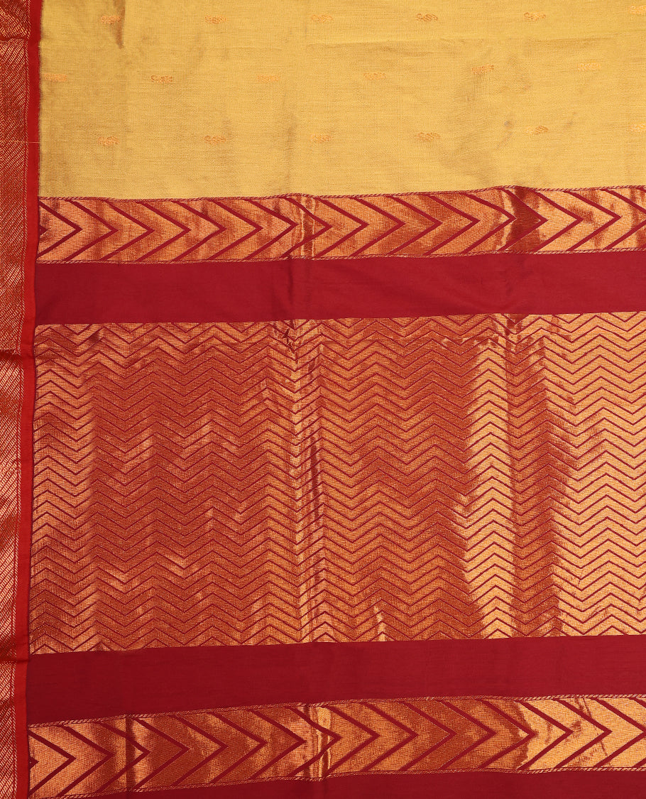 Mustard Yellow and Maroon Kalyani cotton saree featuring subtle woven motifs on the body, complemented by bold zig-zag patterned zari border and pallu, paired with a matching blouse.
