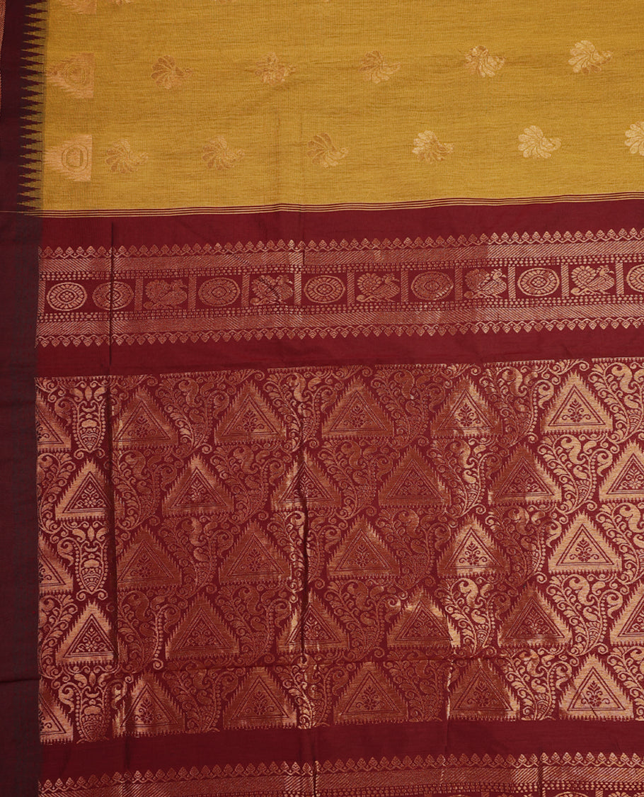 Mustard colour Kalyani cotton saree adorned with zari woven buttas across the body, paired with a rich Maroon colour traditional zari border and pallu, with matching blouse.