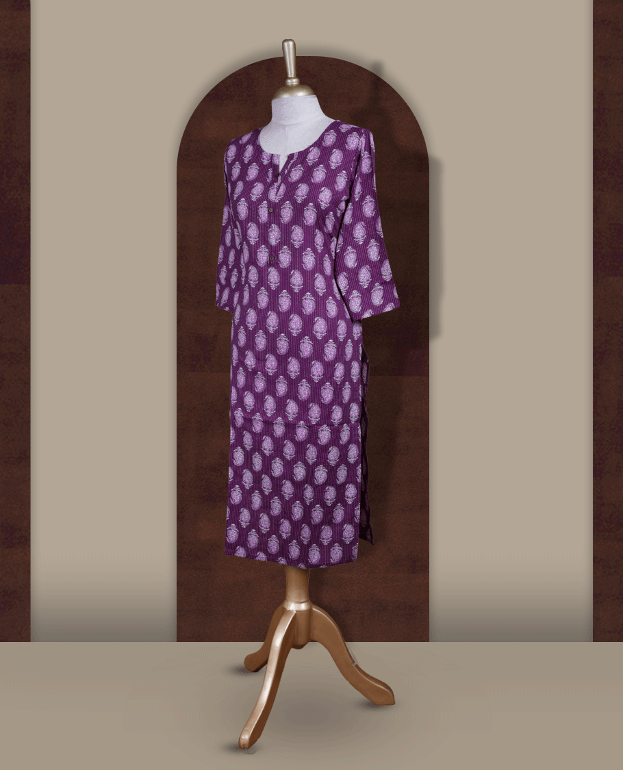 Purple colour kurthi adorned with delicate white paisley prints, featuring a stylish V notch round neckline and comfy 3/4th sleeves & Designed in a straight cut silhouette for a graceful, everyday look.