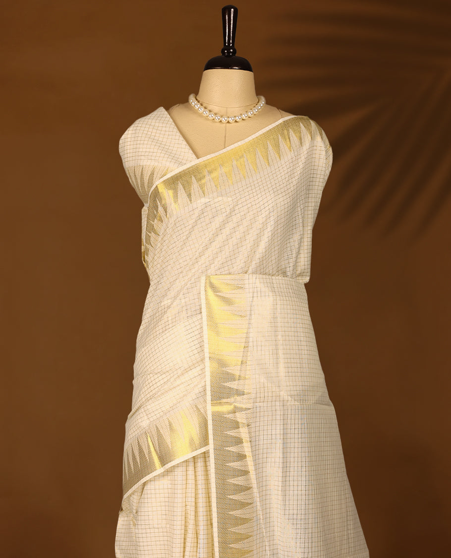 Kerala cotton saree with fine golden Checks and a 3 inch Golden lustrous zari border with Matching Blouse