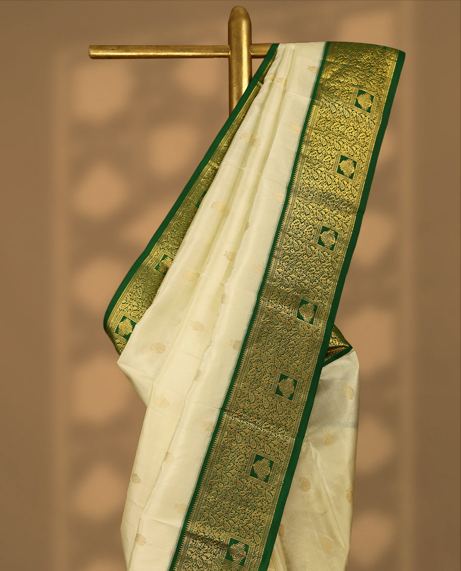 Cream Colour Vasundhara Silk Saree having Golden Thread Buttas in Body with Green Colour Border and Blouse