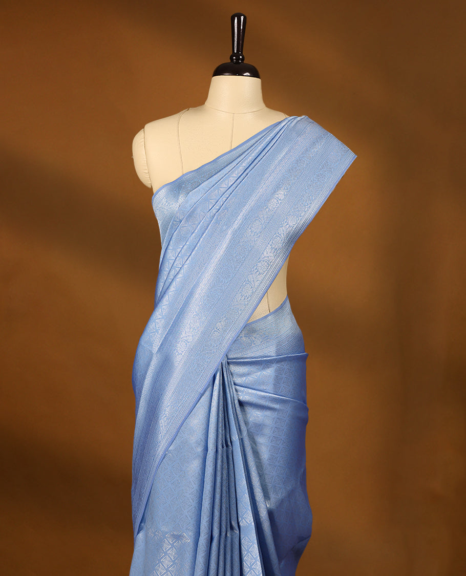 Sky Blue coloured semi silk saree featuring a Silver coloured Zari Diamond design on the body, paired with a Self coloured border and matching blouse.