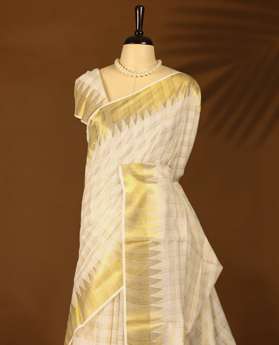 Kerala cotton saree with golden triangle border detailing and subtle checks with Matching Blouse