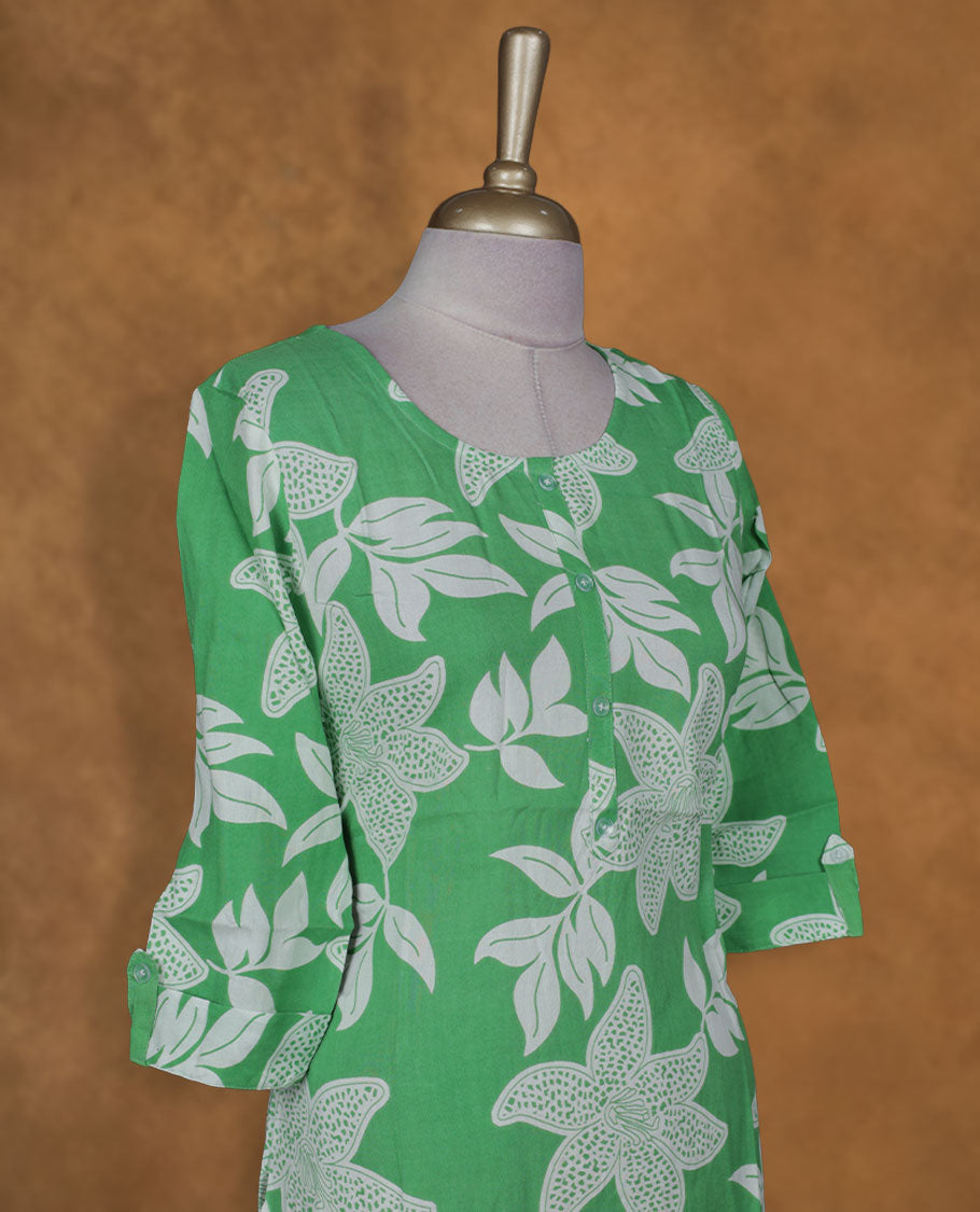 Green and white colour kurti with White floral prints, knee length design, styled with a round neckline and a sleeve .
