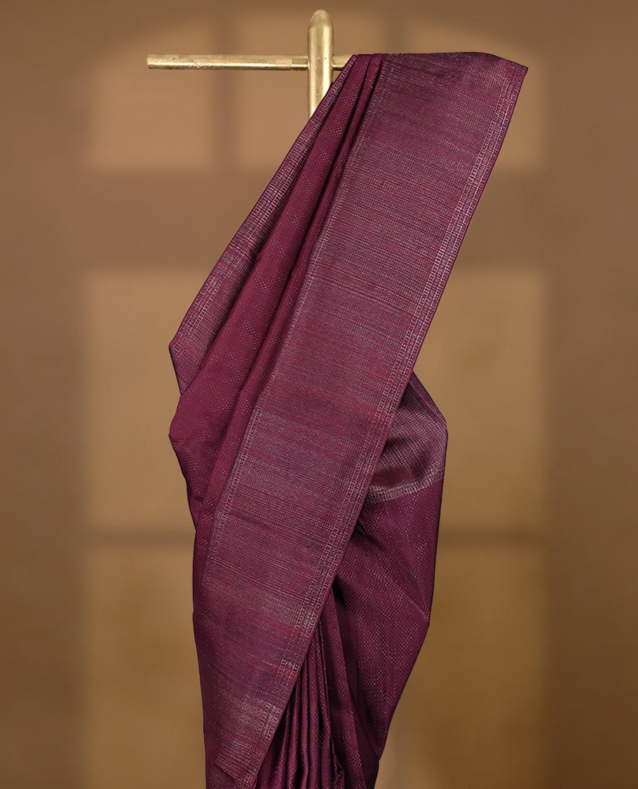 Dark Maroon coloured Manthrakodi saree featuring a multicoloured zari jacquard body, complemented by a self coloured turning Banarasi border and a matching self coloured blouse.