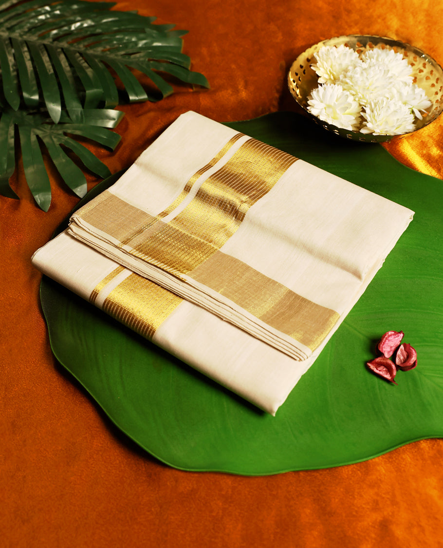 Classic off white colour pure handloom cotton double dhoti with a broad golden zari border, blending simplicity and tradition, perfect for festive occasions and cultural celebrations.
