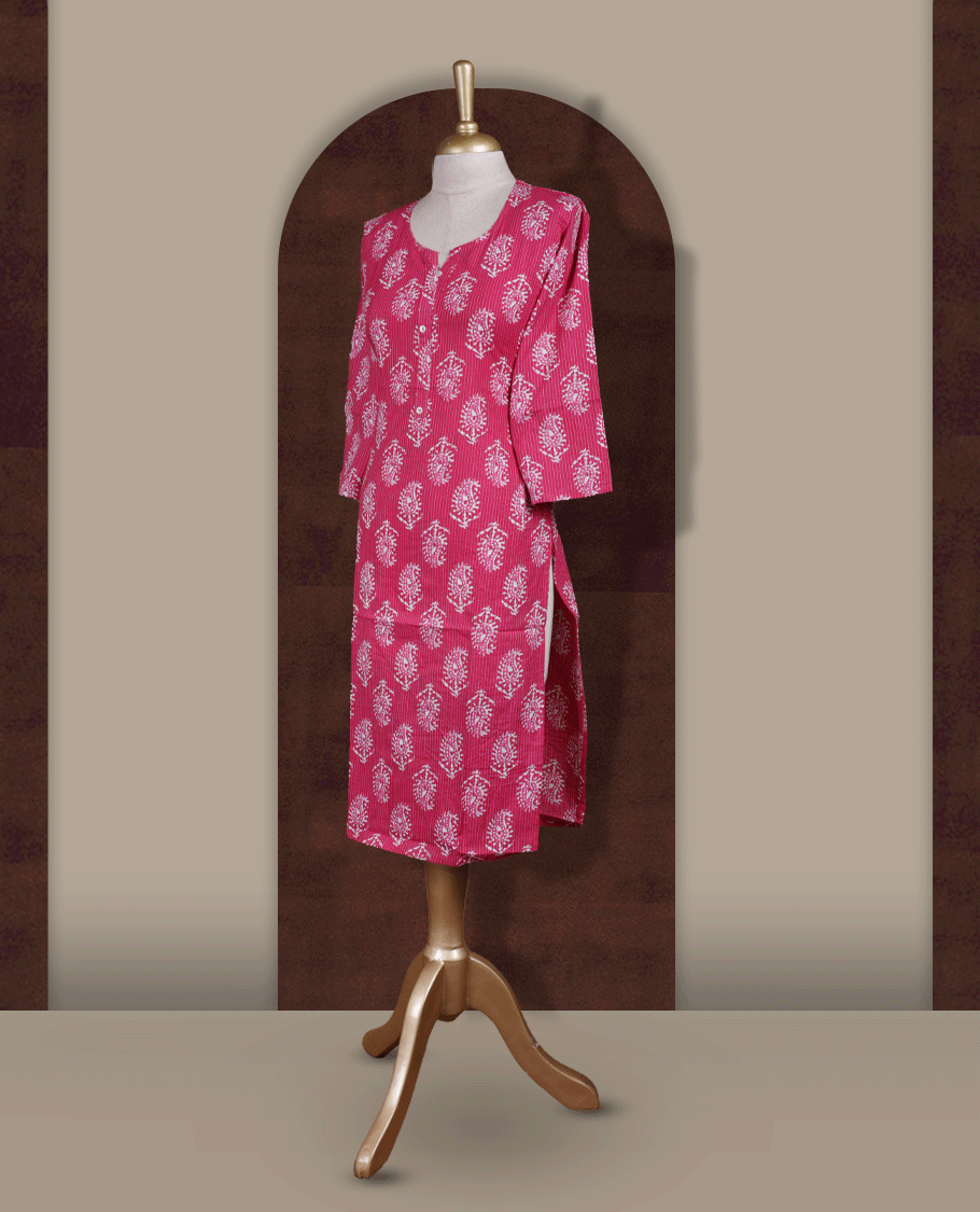 Magenta colour kurthi adorned with delicate white paisley prints, featuring a stylish V notch round neckline and comfy 3/4th sleeves & Designed in a straight cut silhouette for a graceful, everyday look.