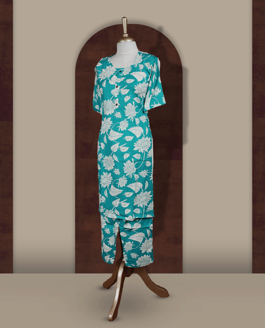 Turquoise blue colour coord set featuring a round neck with short sleeves, adorned with white floral prints